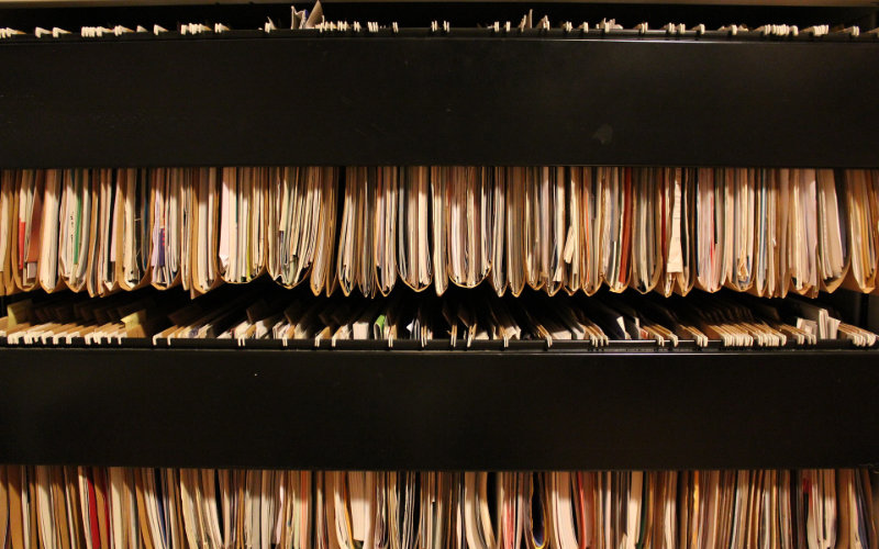 Office files lined up in a cabinet